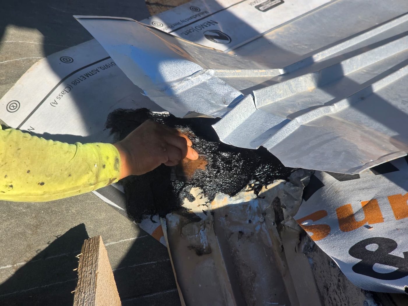 Tile roof flashing repair in progress